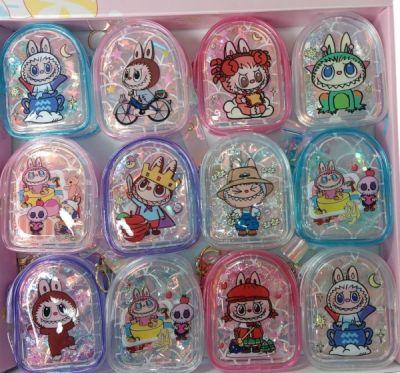 Colorful cartoon character keychains in a box.