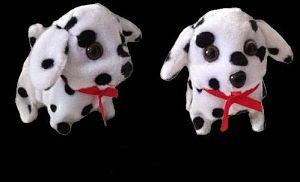 Two plush Dalmatian toys with red bows.