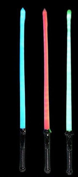 Three colorful glowing toy lightsabers on black.