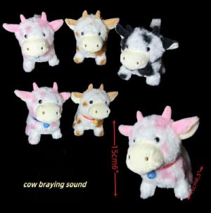 Cute plush cow keychains with various colors and expressions.